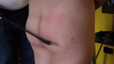 caning her ass while touching her pussy